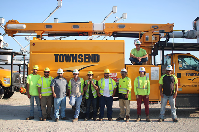 Townsend Employees standing infront of Townsend utility truck