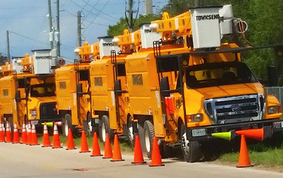 Townsend utility trucks parked on the side of the road following a severe storm.